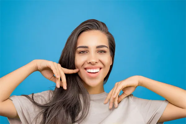 Girl pointing at her teeth